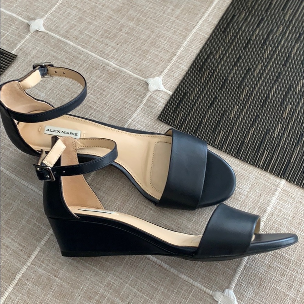 Woman’s navy blue leather wedge sandal